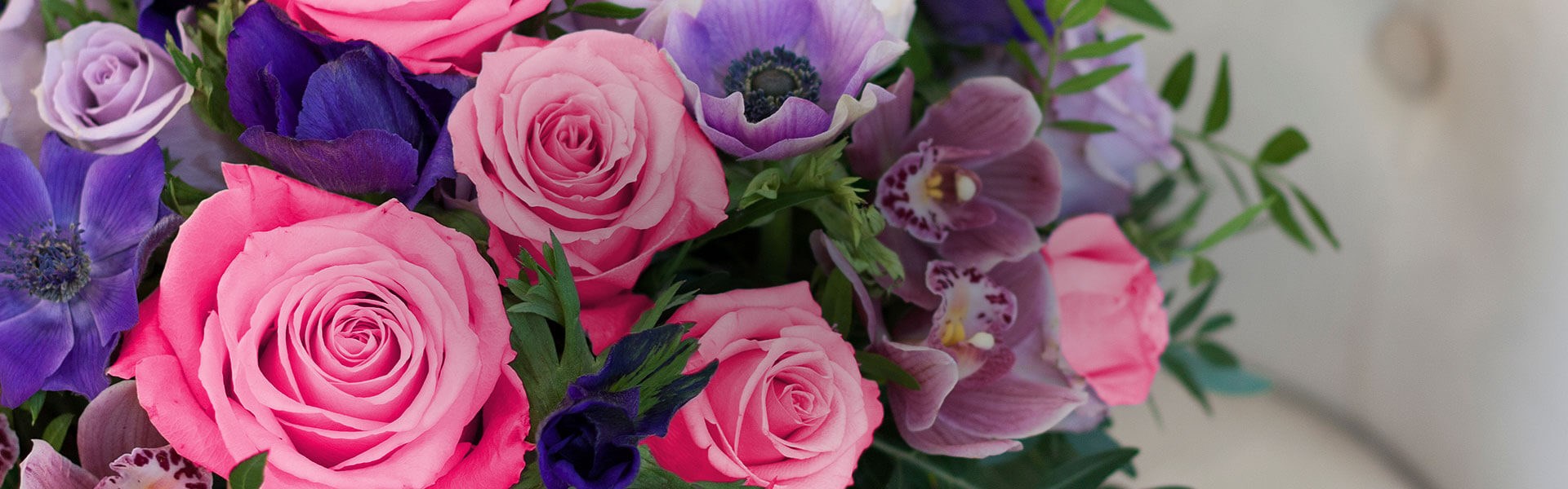 Wide angle of a bouquet of blue, pink and purple flowers
